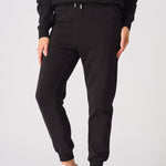 Front shot from the waist down of the smart black tapered joggers womens.