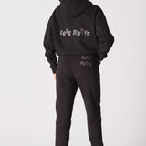 Back view of the black tapered joggers womens showing the clean silhouette.