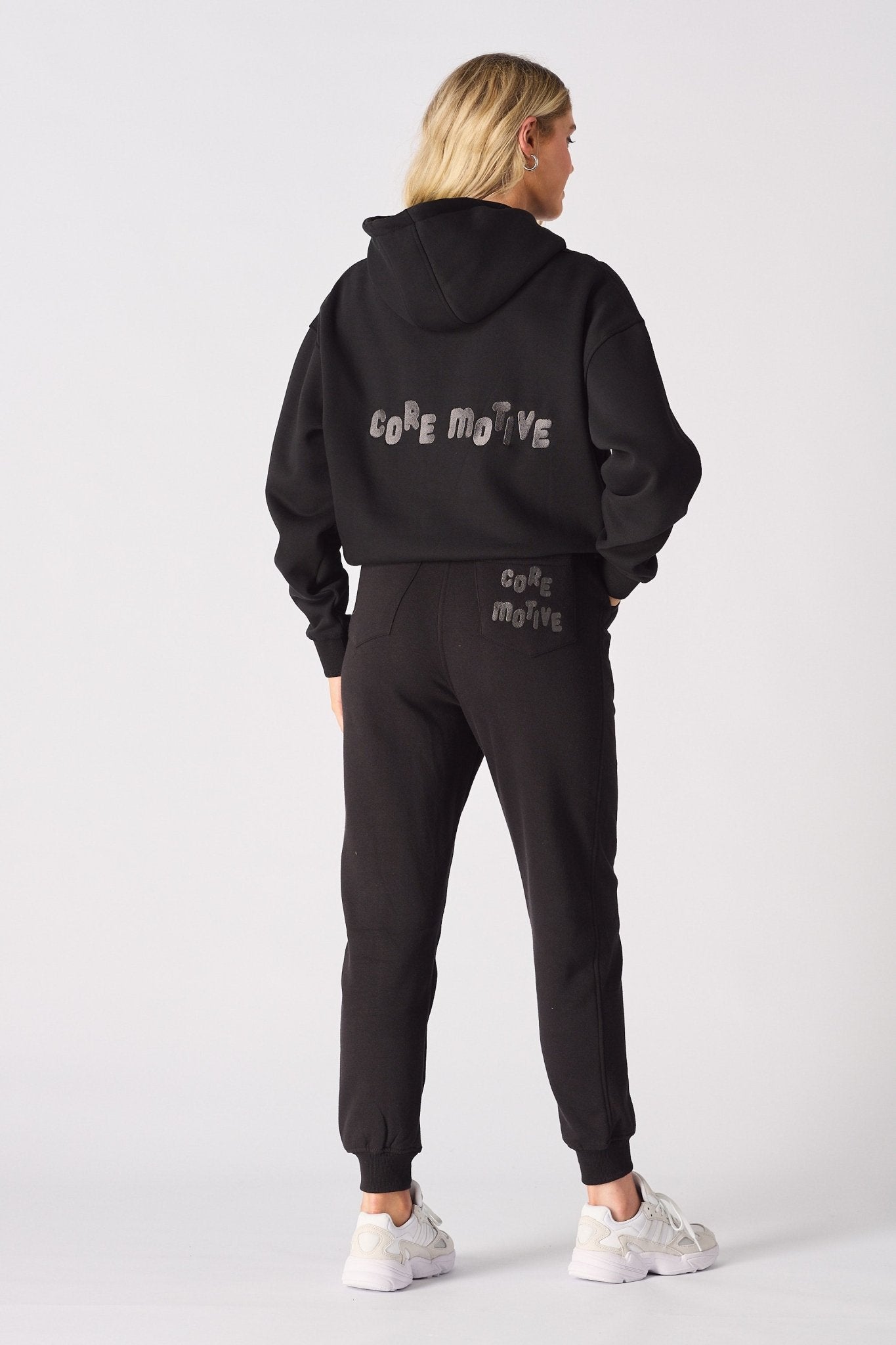 Back view of the black tapered joggers womens showing the clean silhouette.