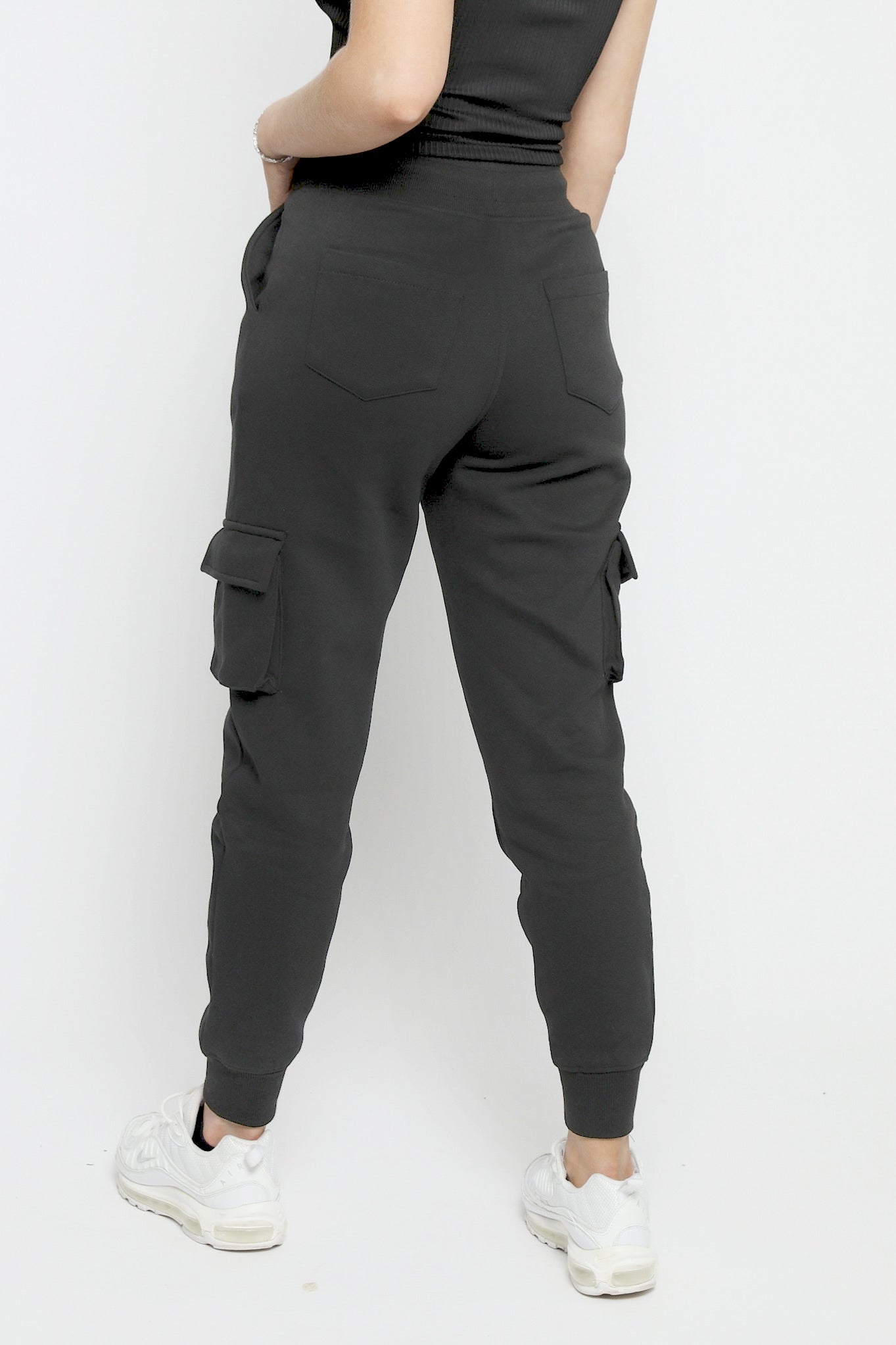 Back view of the black utility joggers womens showing the clean tapered cut.