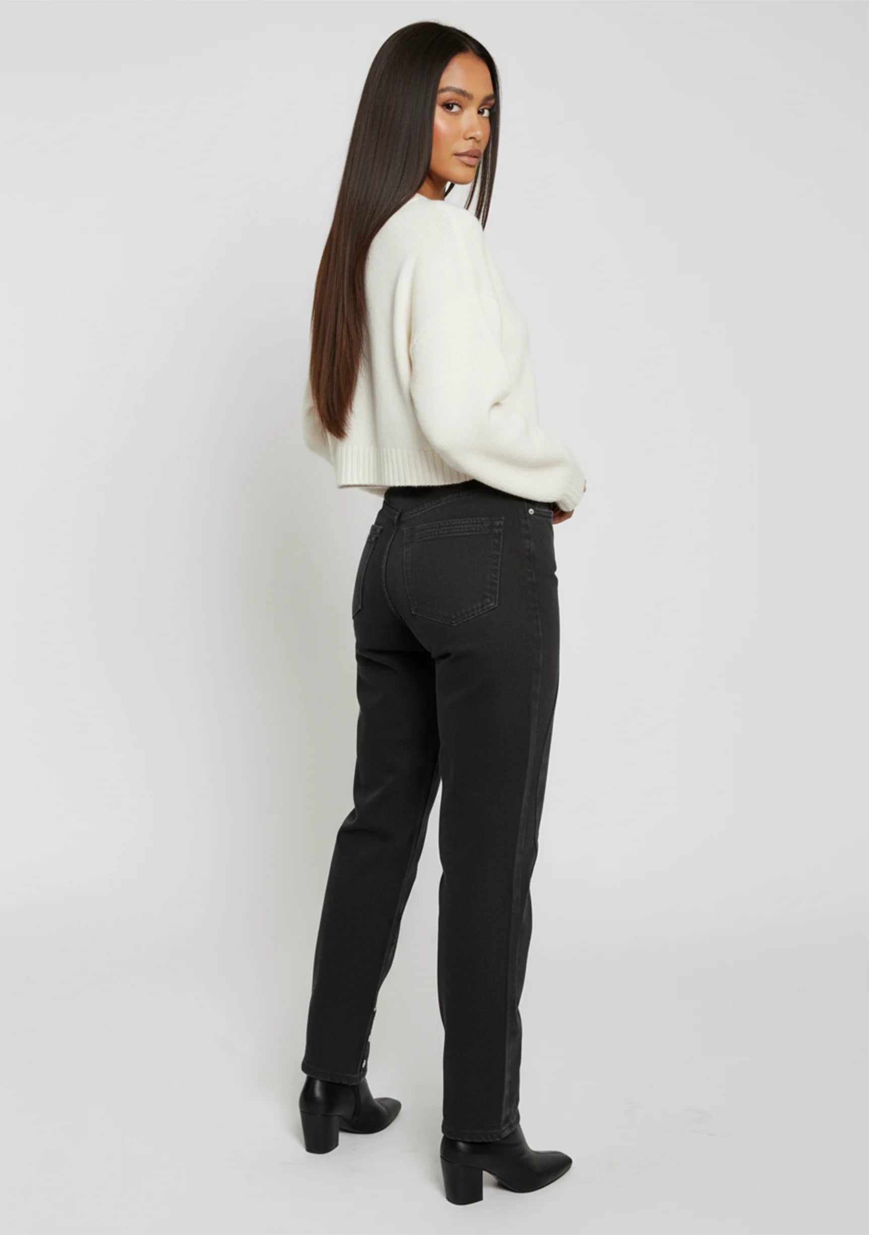Three-quarter back angle view of Black Wash Curved Seam Straight Leg Jeans