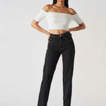 Model in a confident stance wearing Black Wash Denim Popper Jeans for Women