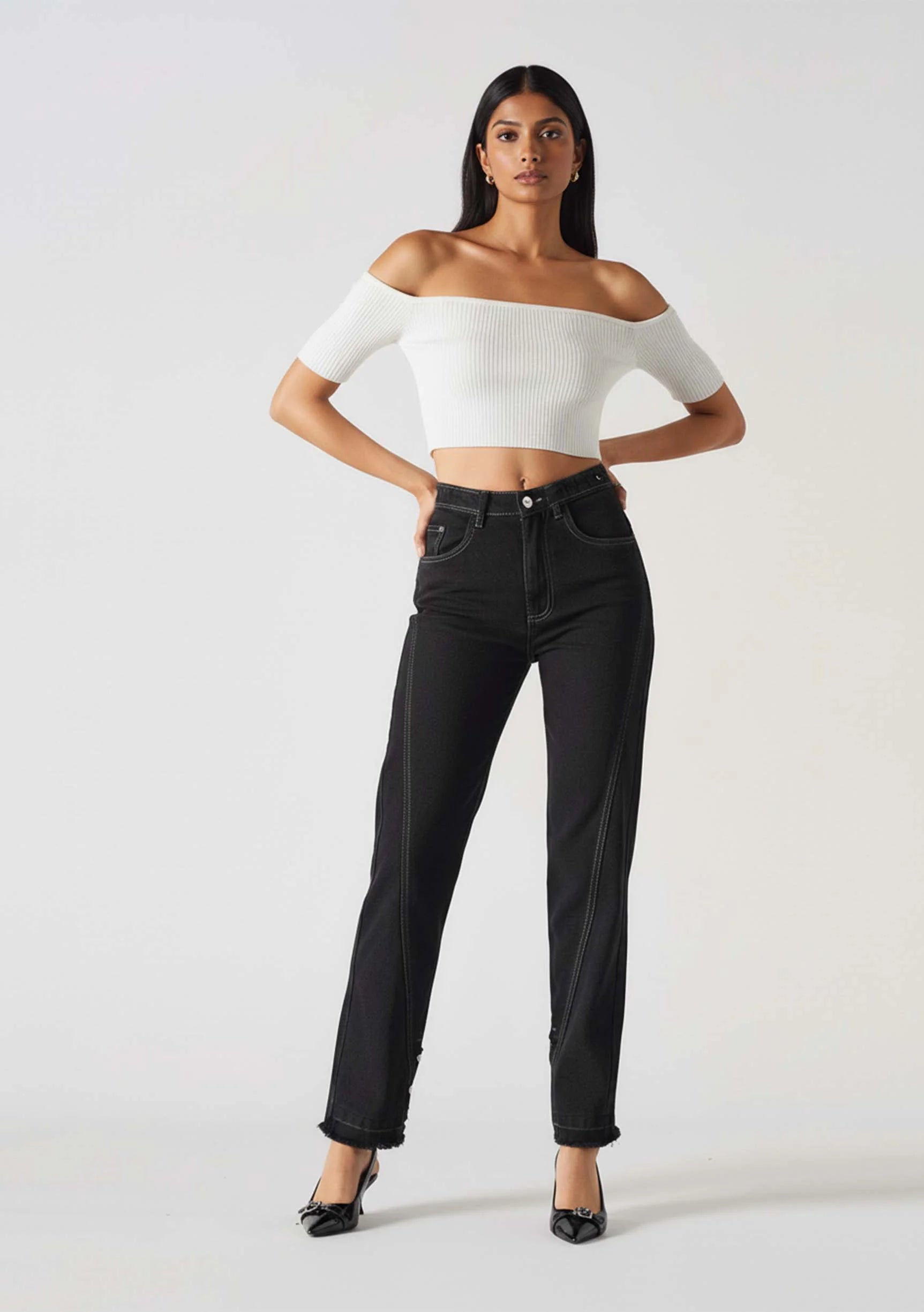 Model in a confident stance wearing Black Wash Denim Popper Jeans for Women