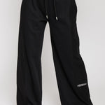 Close up front view of black wide leg joggers for women with a drawstring waist