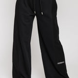 Close up front view of black wide leg joggers for women with a drawstring waist