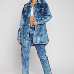 Woman wearing bleach wash straight-leg jeans with matching denim jacket