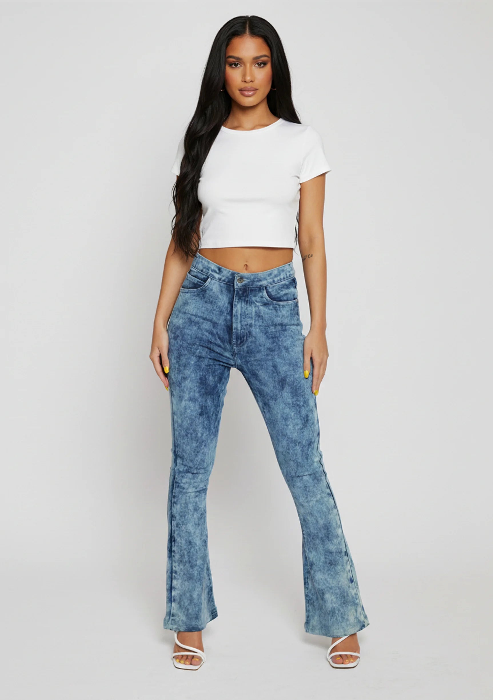 Front view of women's blue acid wash bootcut jeans