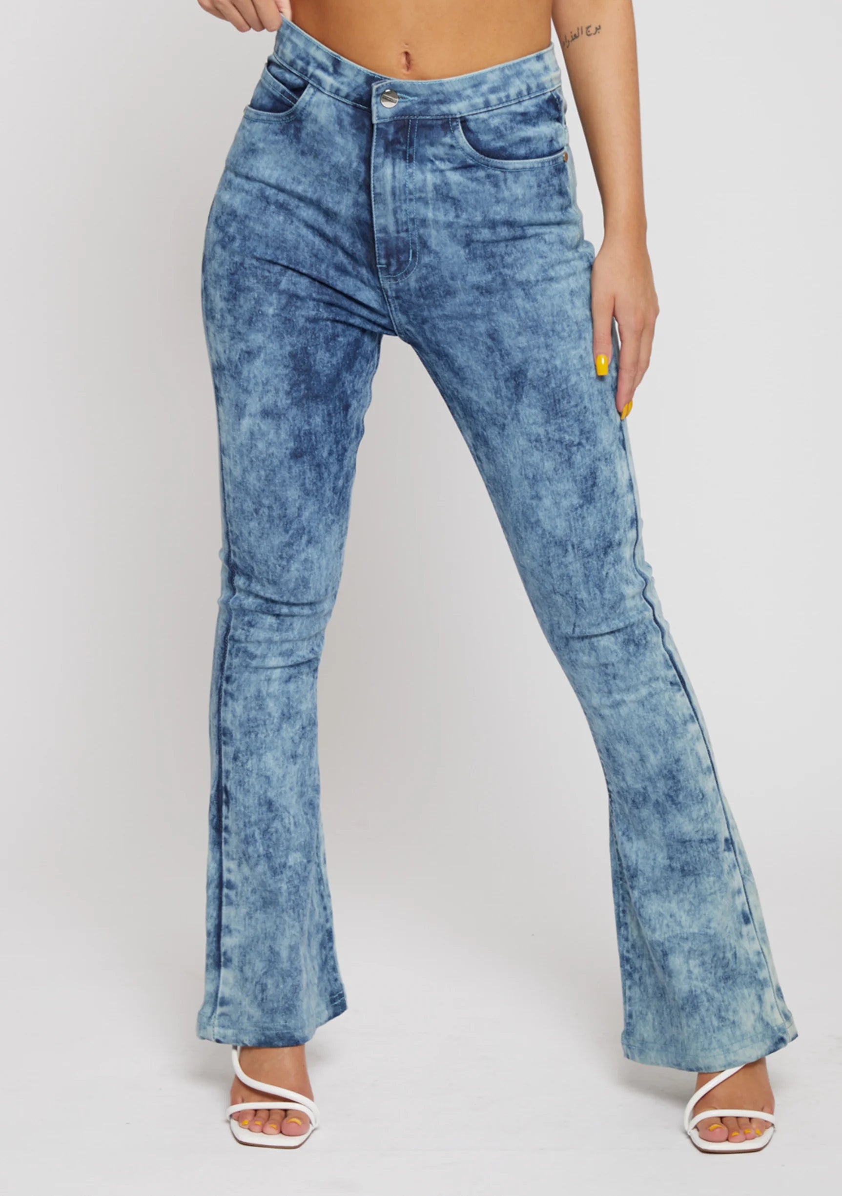 Close up front view of high-waisted blue acid wash jeans