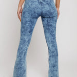 Close up back view of blue acid wash jeans showing pocketless design