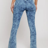 Close up back view of blue acid wash jeans showing pocketless design