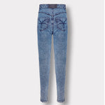 Back view of the blue acid wash skinny jeans with logo patch, laid flat