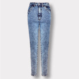 Front view of the blue acid wash skinny jeans, laid flat