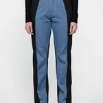 Blue and black pants worn by a person on a white background