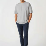 Full body front view of a man wearing Jmojo blue chinos mens in a stretch slim fit.