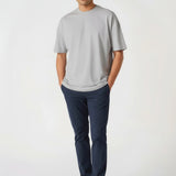 Full body front view of a man wearing Jmojo blue chinos mens in a stretch slim fit.
