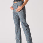 Person wearing blue denim cargo pants on a white background