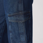Detailed close up of the functional 3D cargo pocket on the blue denim fabric.