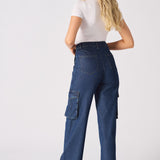 Rear view of a model in blue high waisted wide leg cargo denim jeans women showing the flattering fit.