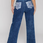 Close up texture view of the silver rhinestone embellishments on the back pockets