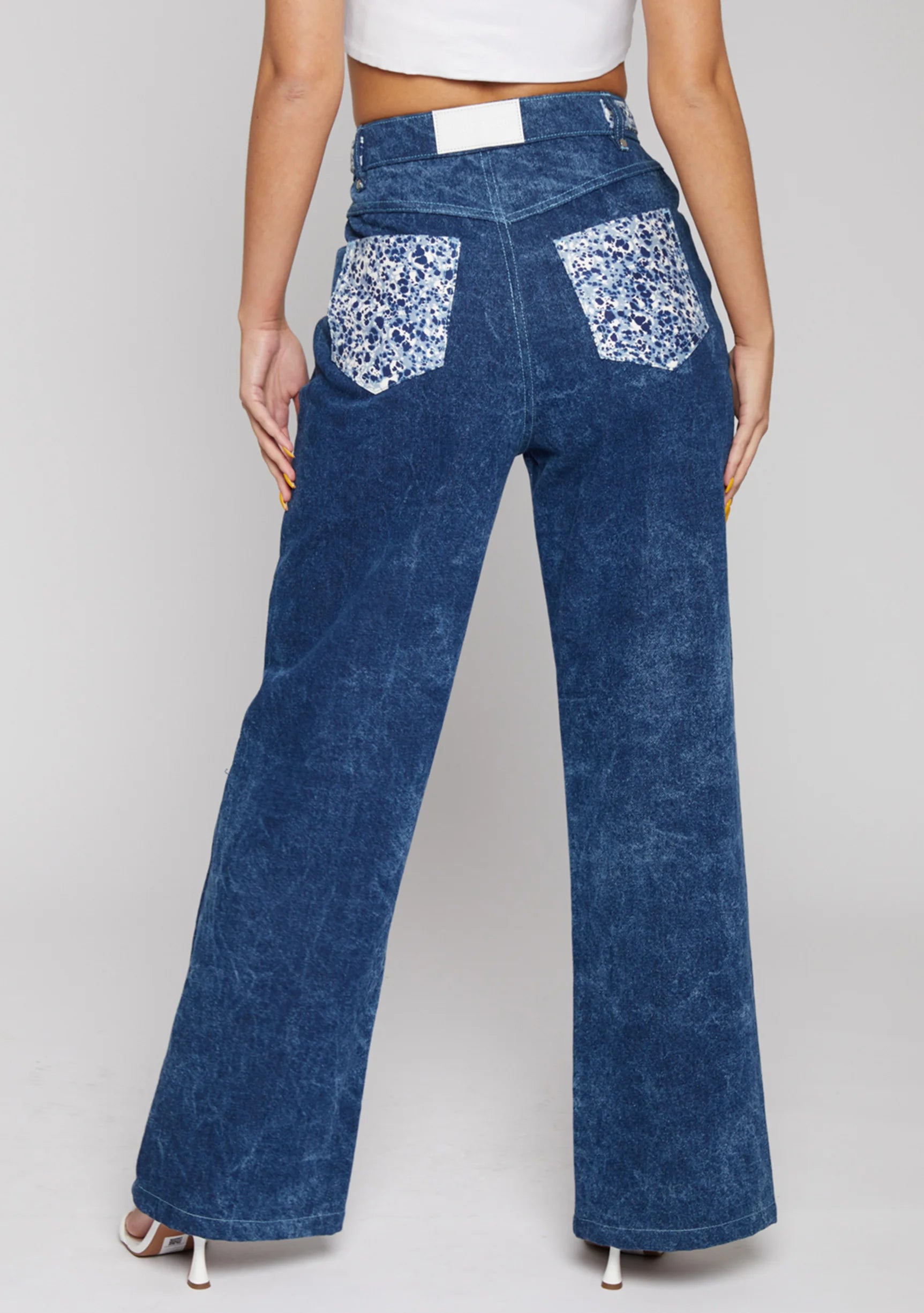 Close up texture view of the silver rhinestone embellishments on the back pockets