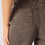 Zoomed in shot of the rear pockets and texture of the chocolate brown cargo jeans for women.