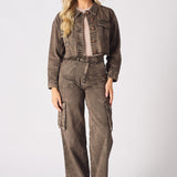 A woman wearing high-waisted wide leg brown cargo jeans for women with a matching denim jacket.