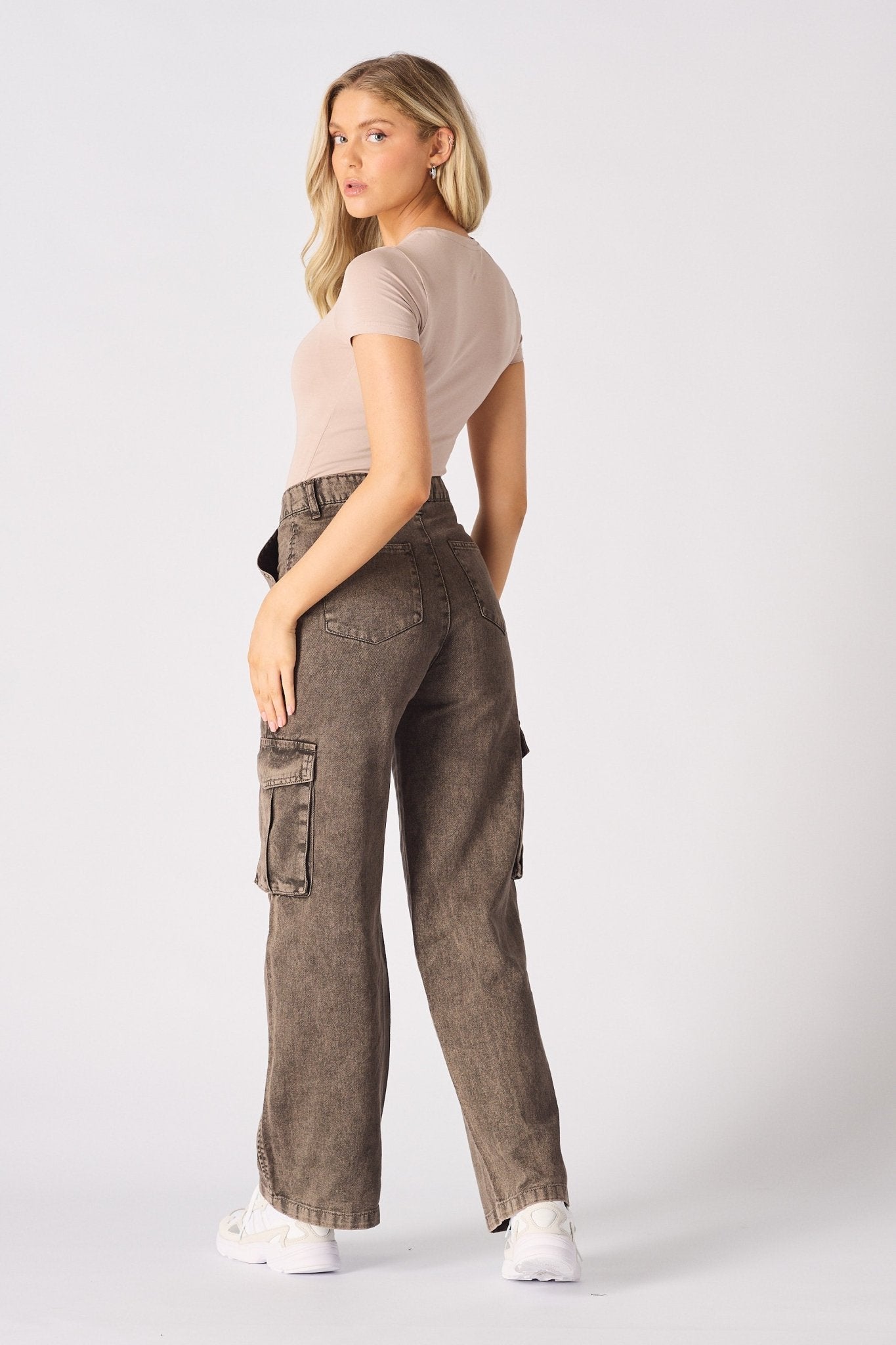 Back view of the wide leg brown cargo jeans showing the flattering high-waisted silhouette.