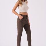 Side view of brown cargo jeans for women highlighting the sleek skinny leg fit.