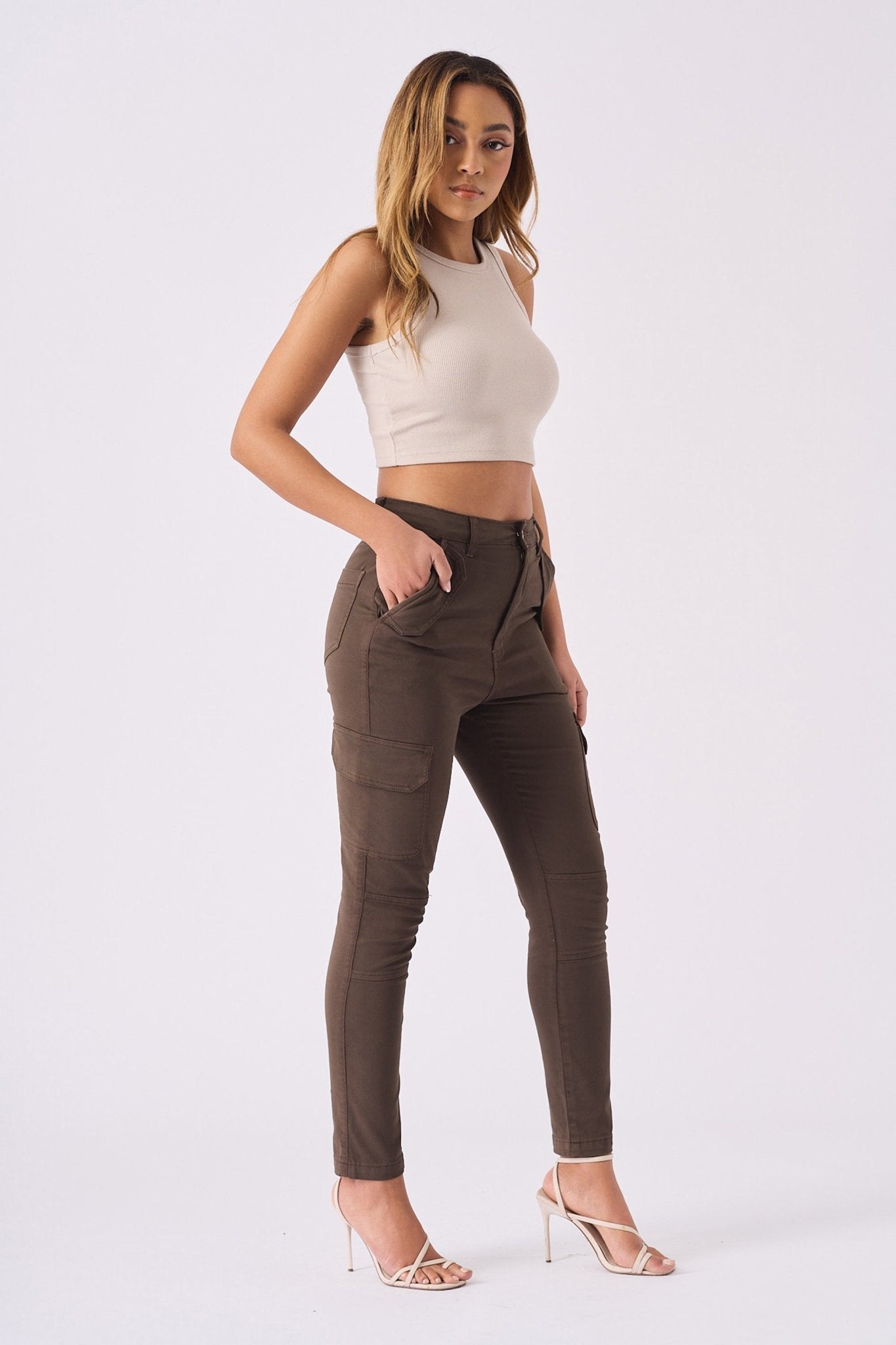 Side view of brown cargo jeans for women highlighting the sleek skinny leg fit.