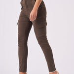 Side profile of a model walking in brown skinny cargo jeans showing the utility pockets.
