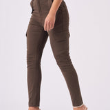Side profile of a model walking in brown skinny cargo jeans showing the utility pockets.