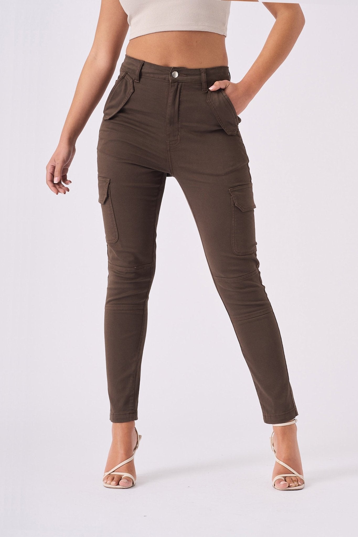 Full length front shot of the brown cargo jeans for women with functional pocket details.