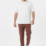 Brown tapered joggers front angled view