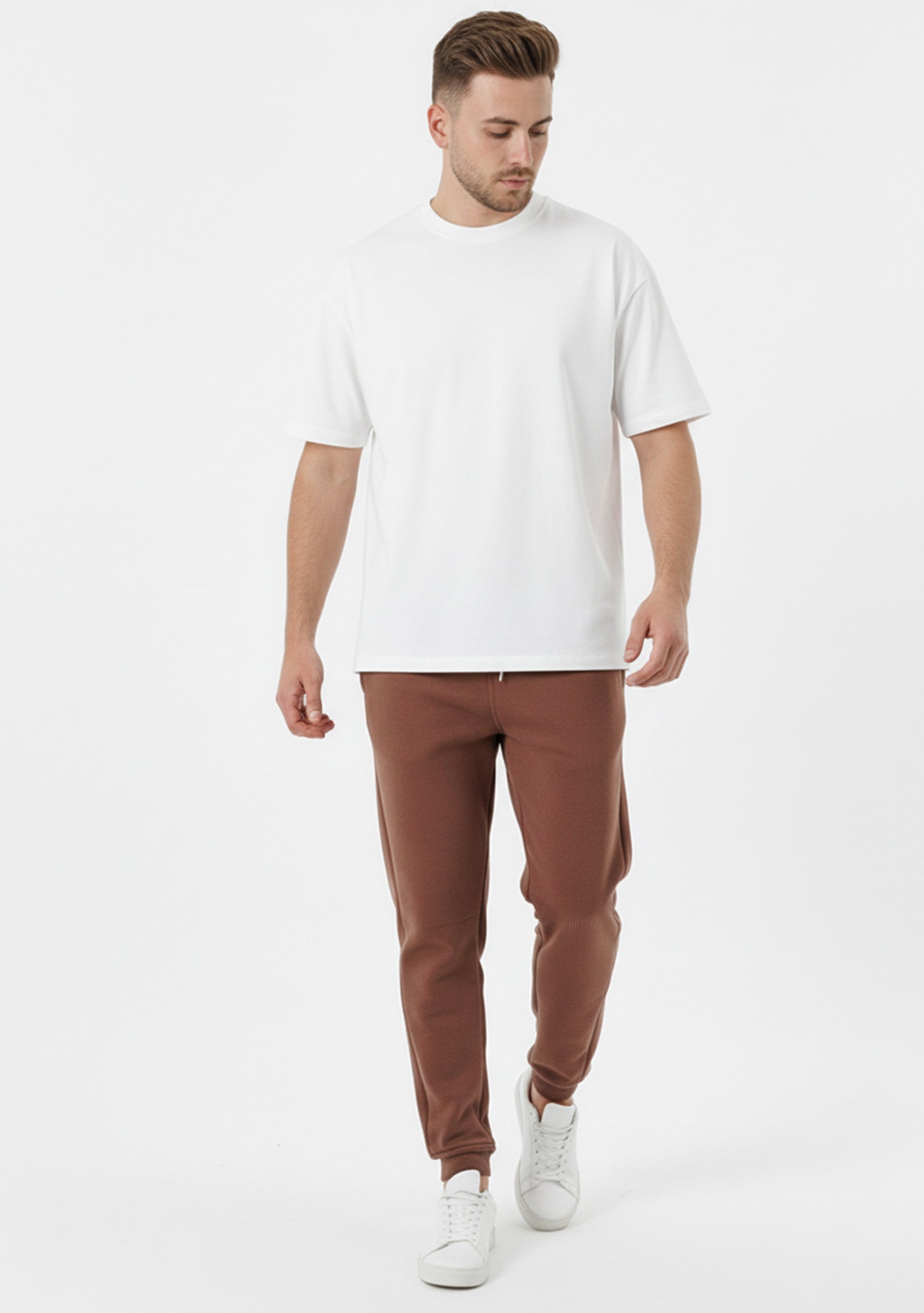 Brown tapered joggers front angled view