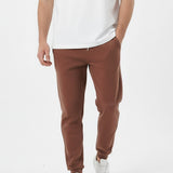 Brown tapered joggers front walking pose