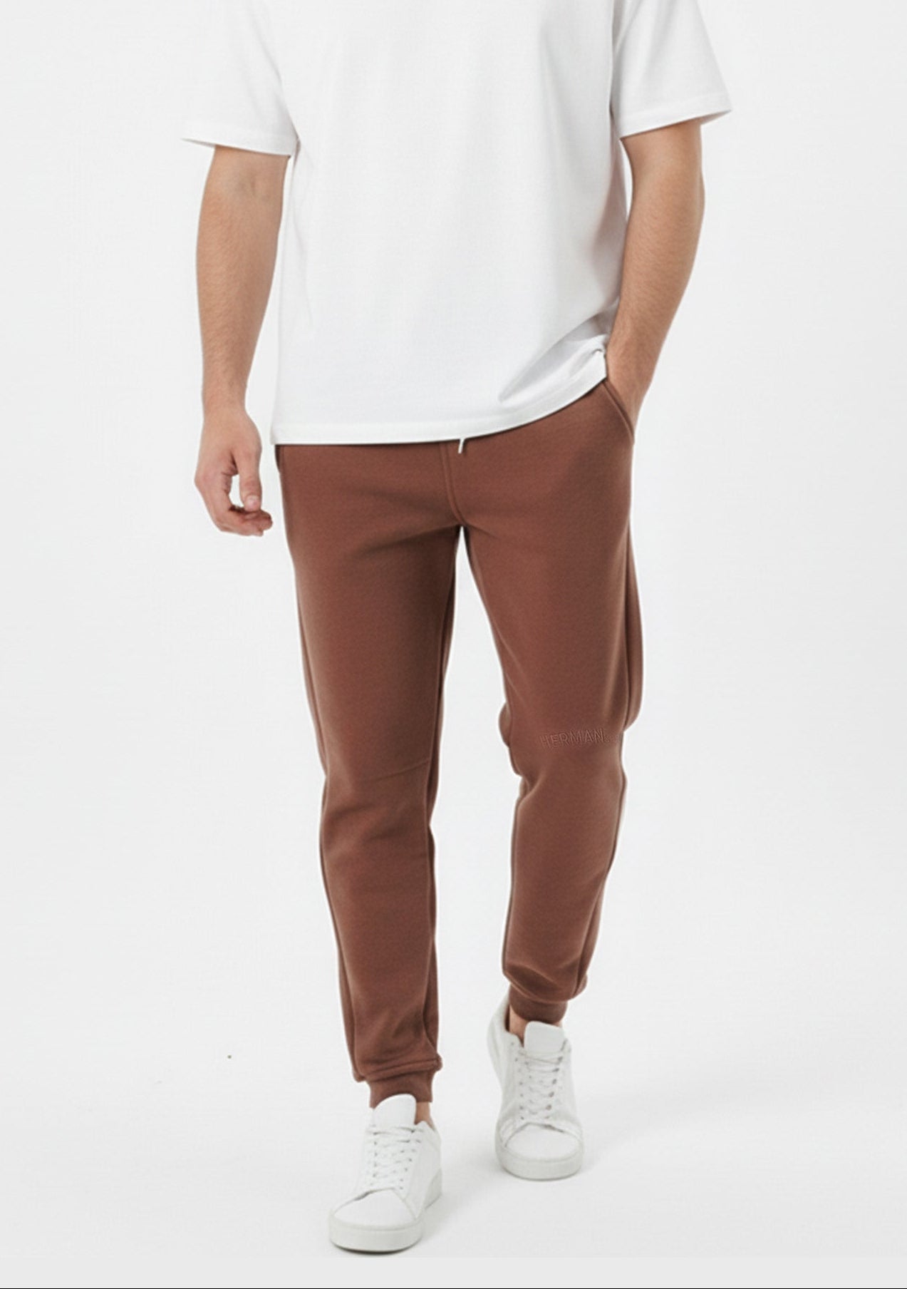 Brown tapered joggers front walking pose