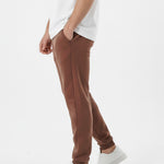Brown tapered joggers side close up showing ribbed cuffs