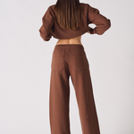 Rear view of chocolate brown wide leg joggers with a matching cropped hoodie