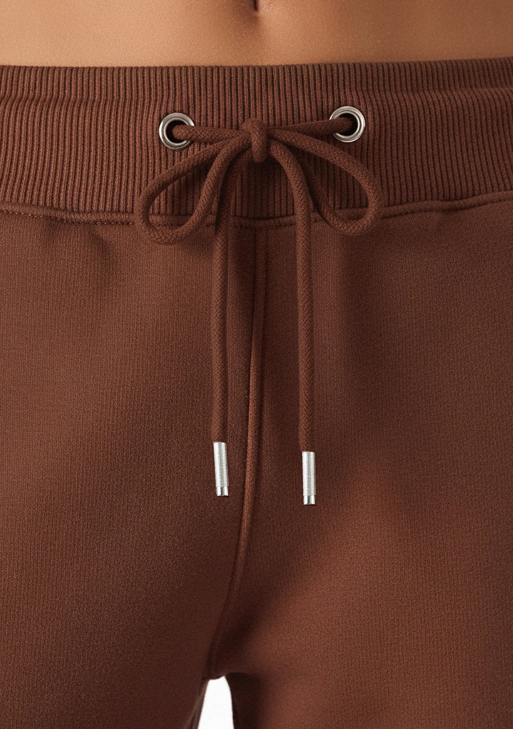 Detail shot of the brown drawstring waist on the wide leg joggers