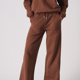 Full front view of a woman wearing a matching chocolate brown jogger set