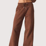 Close up of the high waist on these chocolate brown wide leg joggers