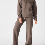 Front view shot of the high rise brown wide leg joggers women from the waist down.