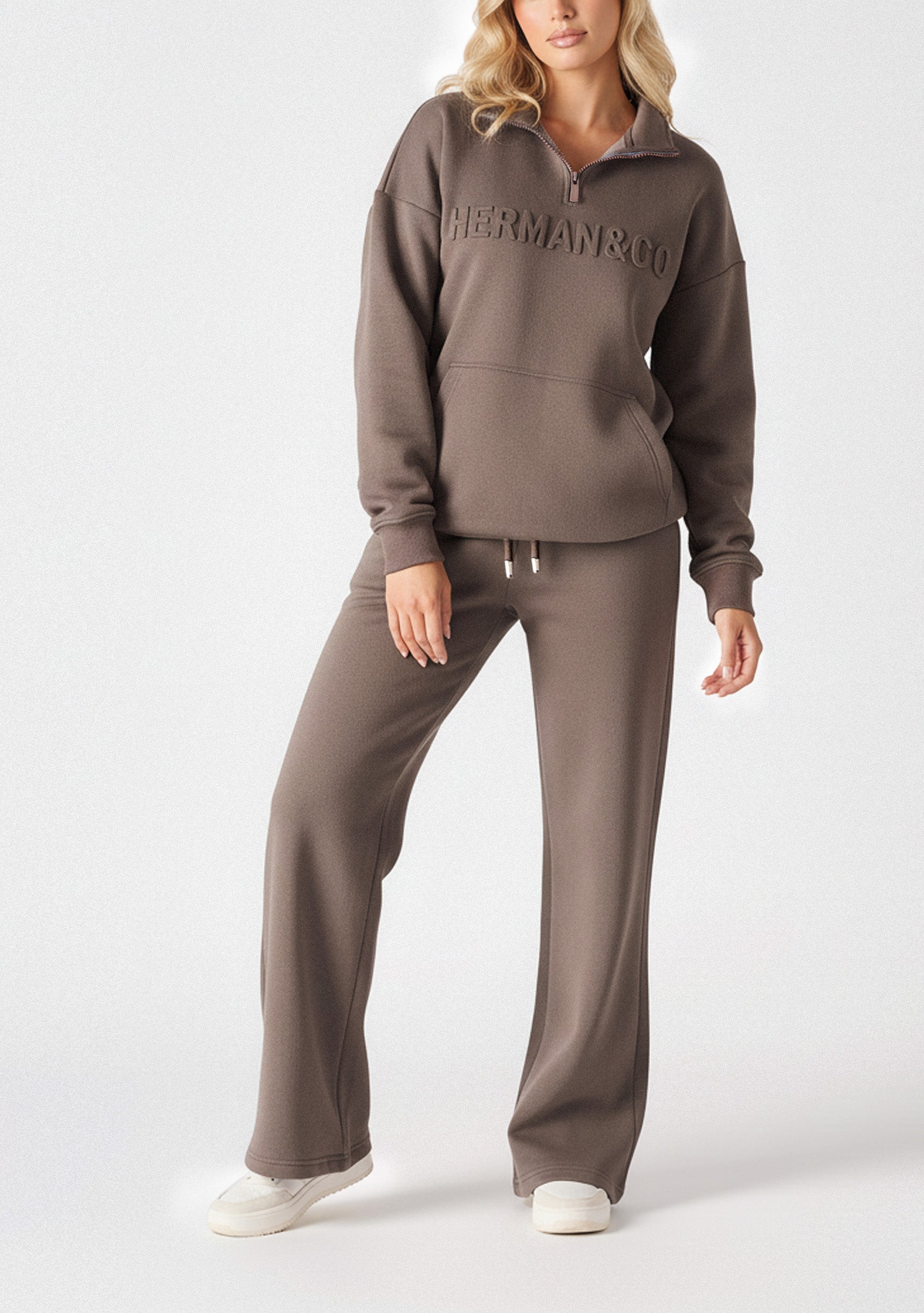Front view shot of the high rise brown wide leg joggers women from the waist down.