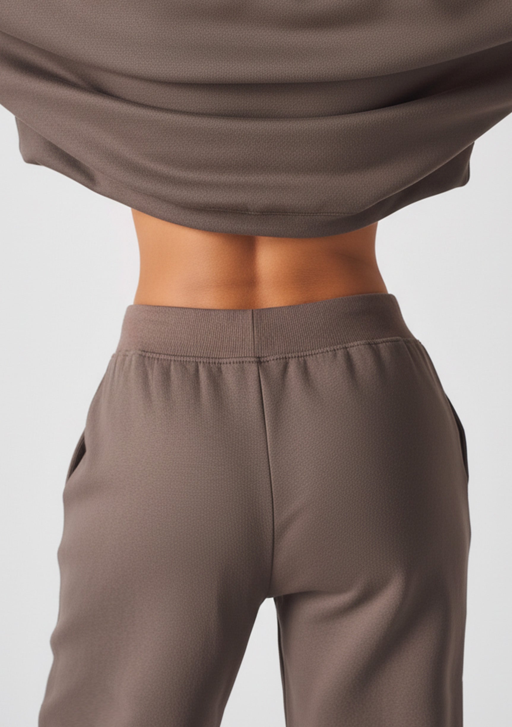 Close up showing the high rise back waist of the brown wide leg joggers women.