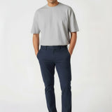 Relaxed casual styling featuring stretch slim fit chino pants blue for men.