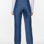Full back view of women's high-waisted color-block jeans in dark blue denim