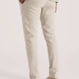 Detail view of the back pockets on stylish cream chinos for men by Jmojo.