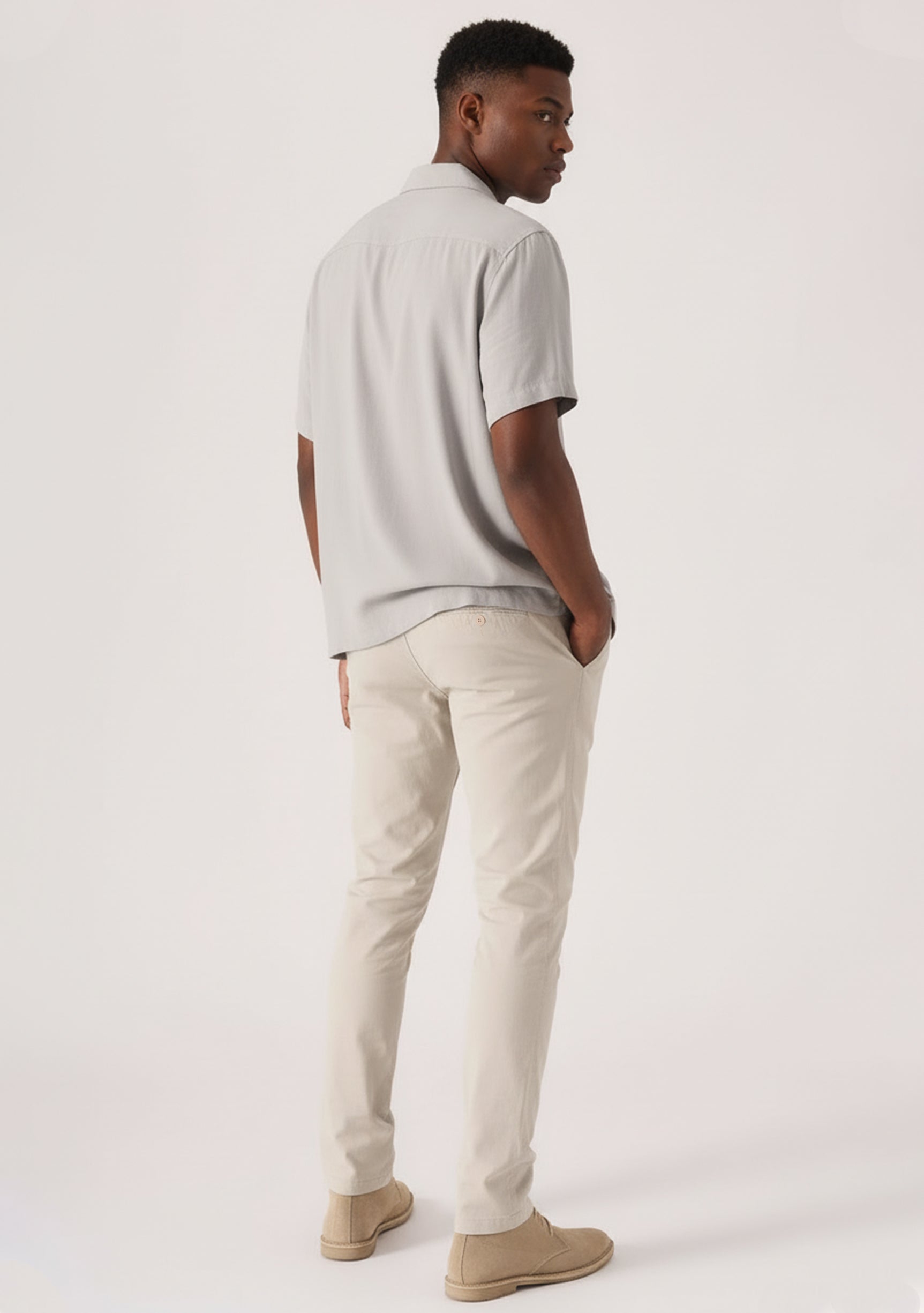 Close-up front view of cream chinos men showcasing the tailored stretch fit.