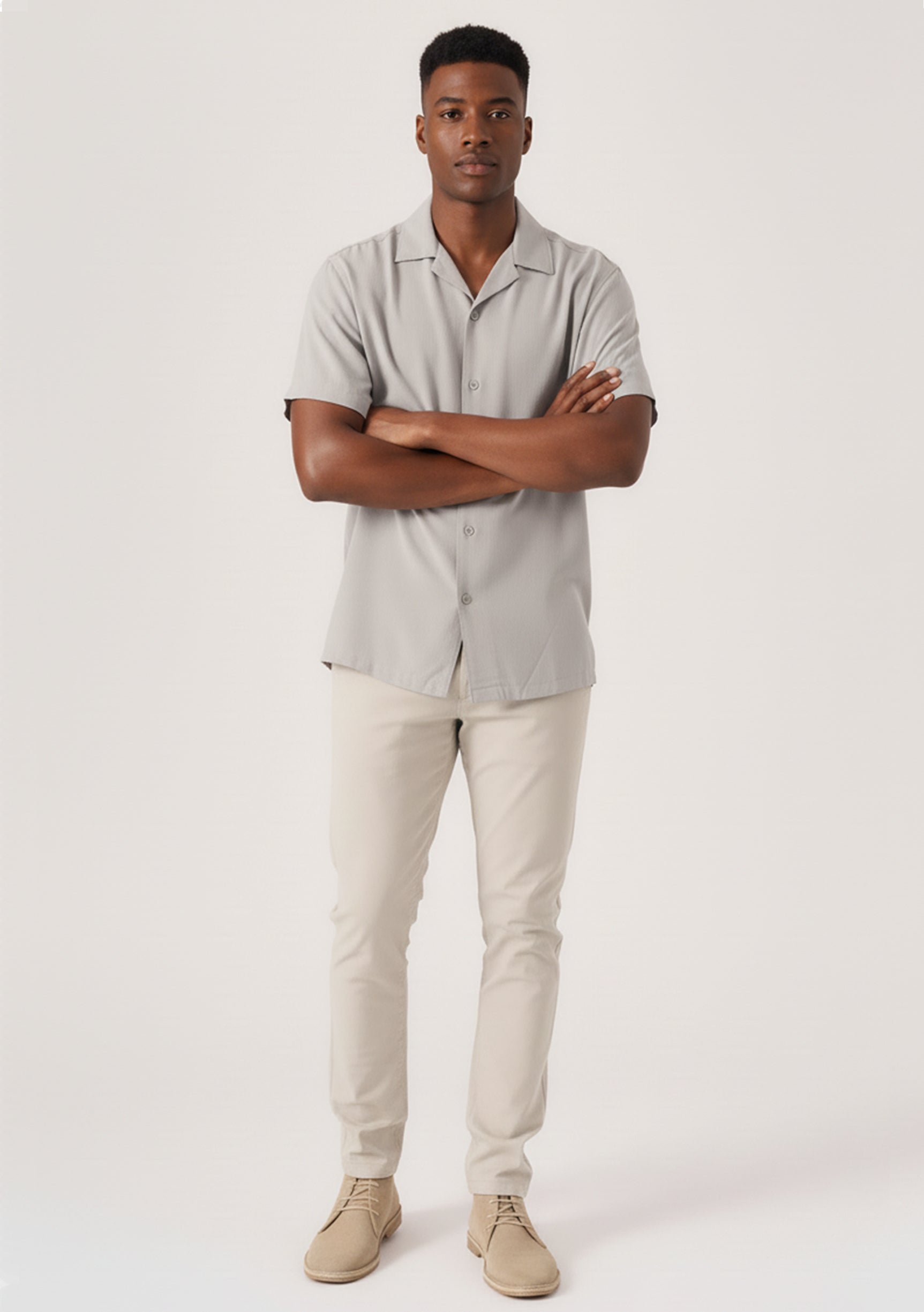 Full front view of a man standing in casual stretch cream trousers by Jmojo.