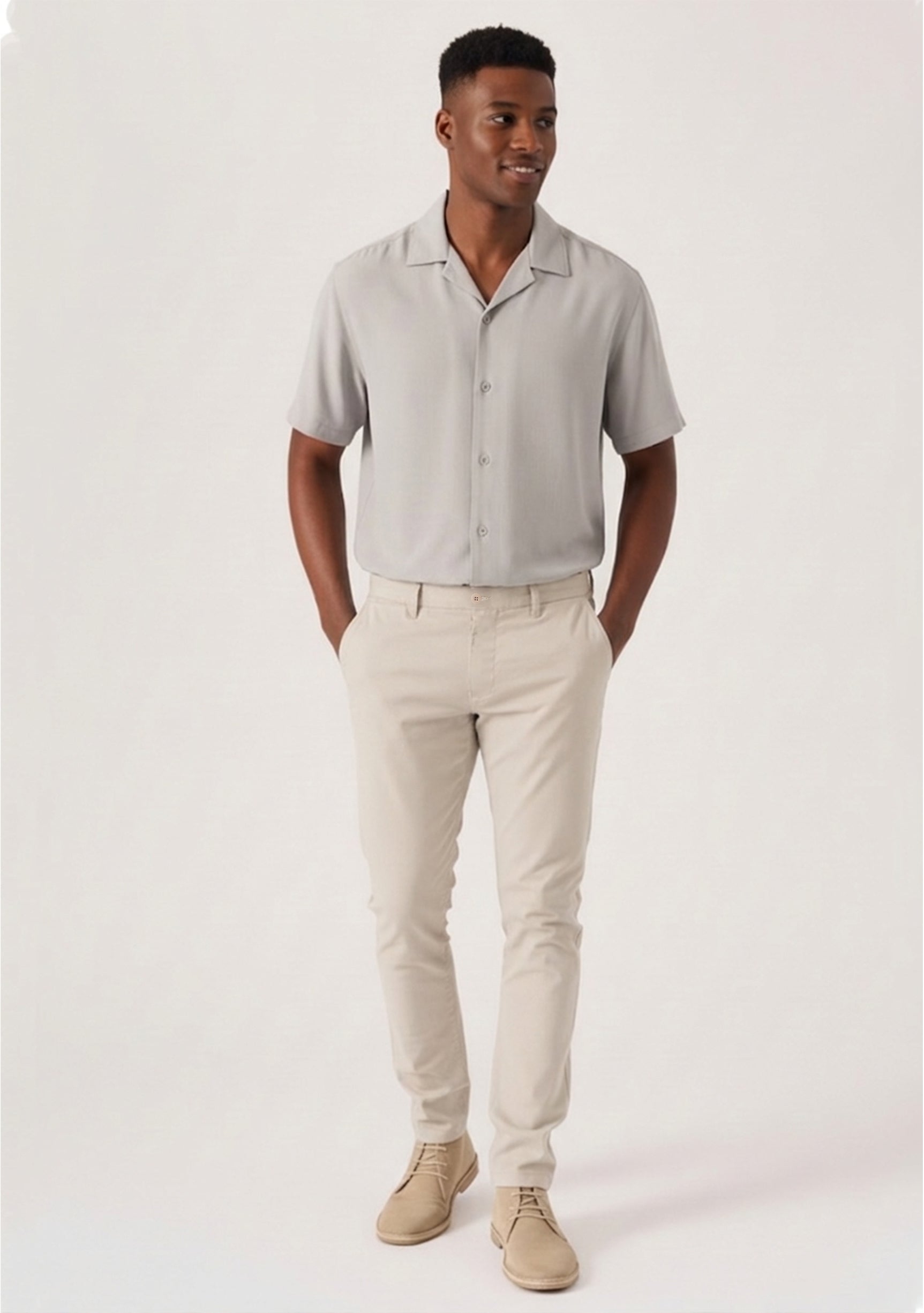 Full back view of a model wearing stretch slim fit cream trousers mens.